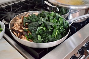sauteing shiitake mushrooms and kale for mighty macro plates