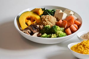 Plant lover's mighty macro plate - quinoa, mushrooms, squash, kale, tofu, carrot, & broccoli.